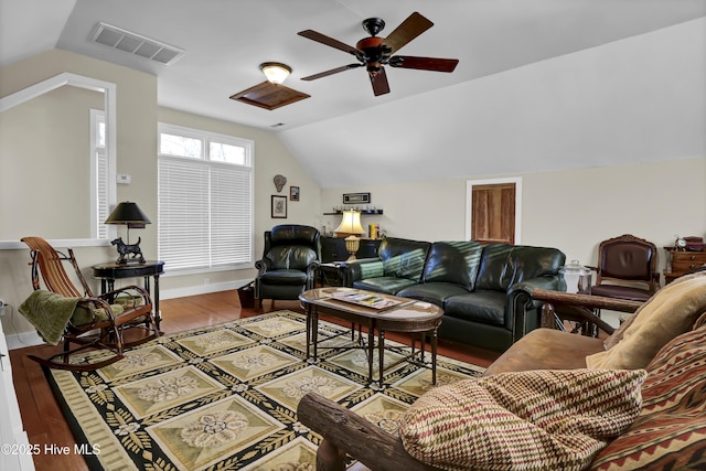 living room featuring ceiling fan, wood-type flooring, and vaulted ceiling