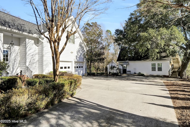 view of property exterior with a garage