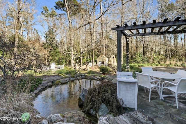 deck featuring a pergola and a patio area