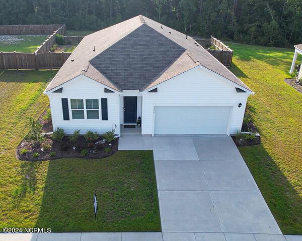 ranch-style house with a front lawn and a garage