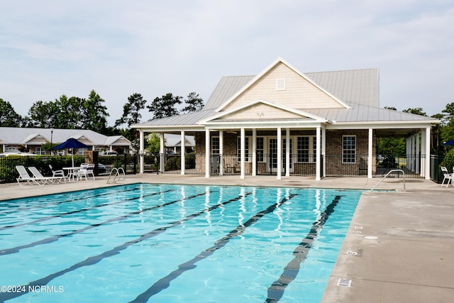 view of swimming pool with a patio