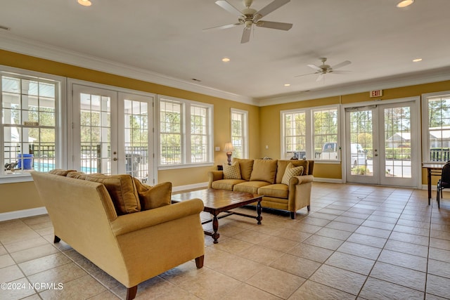 sunroom / solarium featuring french doors and ceiling fan