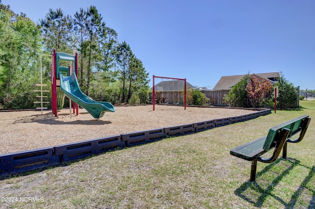 view of playground with a yard