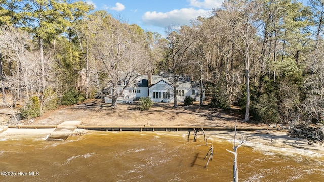 back of house with a water view