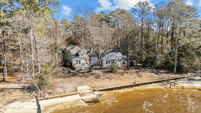 back of house featuring a water view