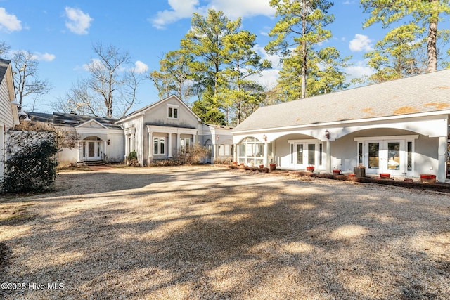 back of property featuring french doors