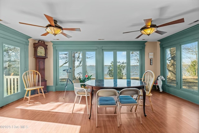 sunroom / solarium with ceiling fan