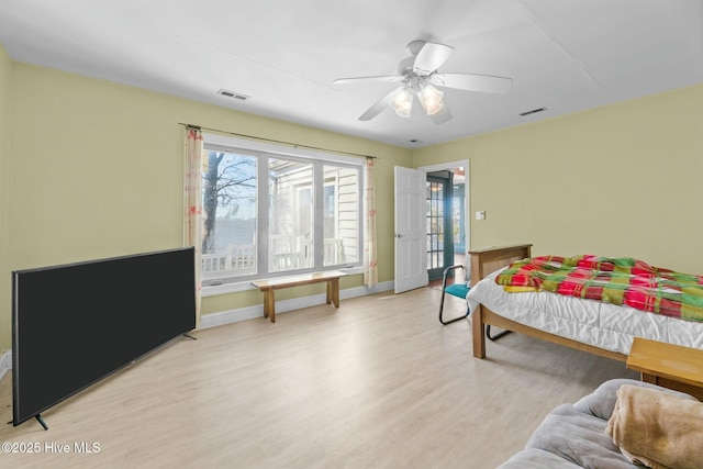 bedroom with ceiling fan and light wood-type flooring