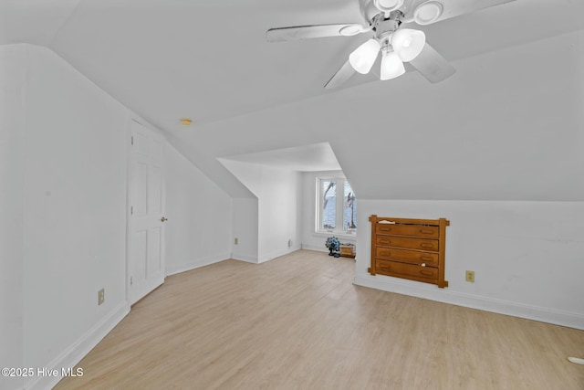 additional living space with vaulted ceiling, ceiling fan, and light hardwood / wood-style floors