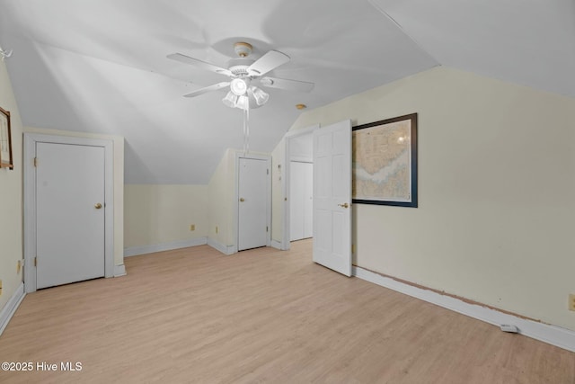 additional living space with ceiling fan, lofted ceiling, and light hardwood / wood-style floors