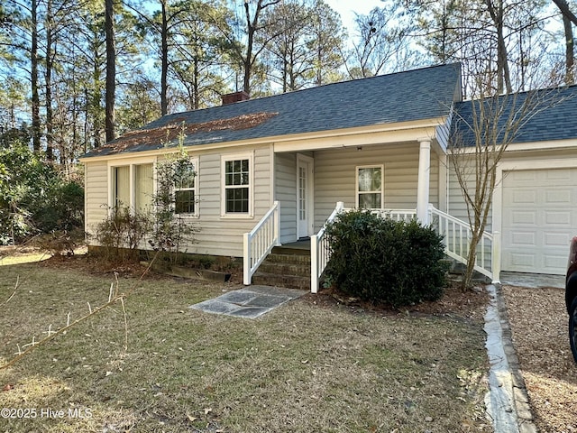 ranch-style home featuring a garage and covered porch