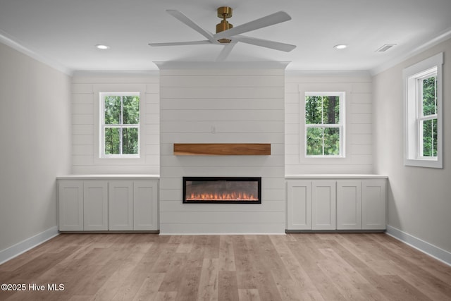 629 Vale Dr, Wilmington, NC 28411 - unfurnished living room with crown molding, light wood finished floors, healthy amount of natural light, a ceiling fan, and recessed lighting