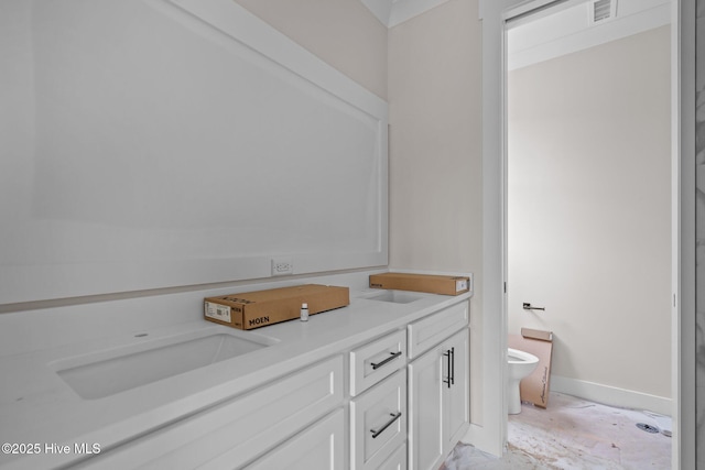 full bath featuring double vanity, toilet, a sink, baseboards, and visible vents