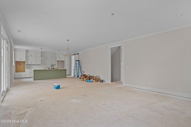 unfurnished living room featuring crown molding