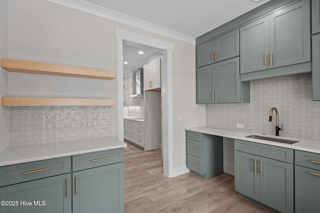 629 Vale Dr, Wilmington, NC 28411 - kitchen with open shelves, a sink, tasteful backsplash, green cabinetry, and recessed lighting