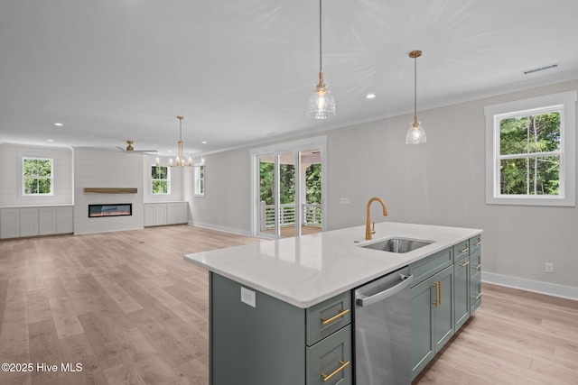 629 Vale Dr, Wilmington, NC 28411 - kitchen with dishwasher, a sink, baseboards, light wood-style floors, and recessed lighting