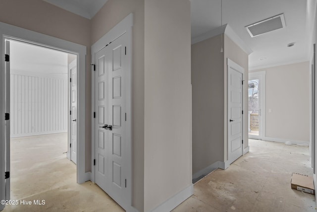 hall featuring baseboards and visible vents