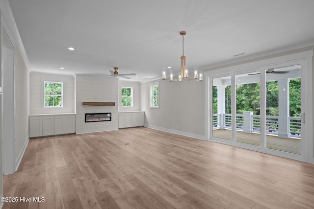 629 Vale Dr, Wilmington, NC 28411 - unfurnished living room featuring a ceiling fan, baseboards, recessed lighting, a glass covered fireplace, and light wood finished floors