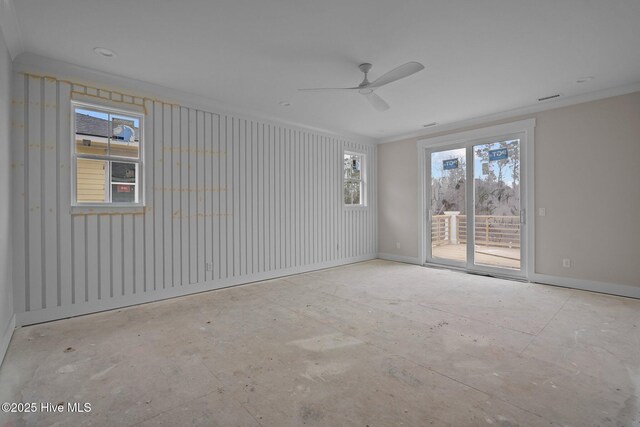 spare room featuring visible vents, a ceiling fan, ornamental molding, and baseboards