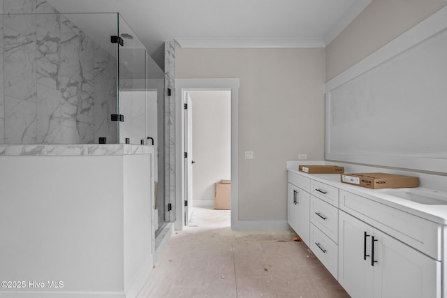 bathroom with ornamental molding, vanity, and an enclosed shower