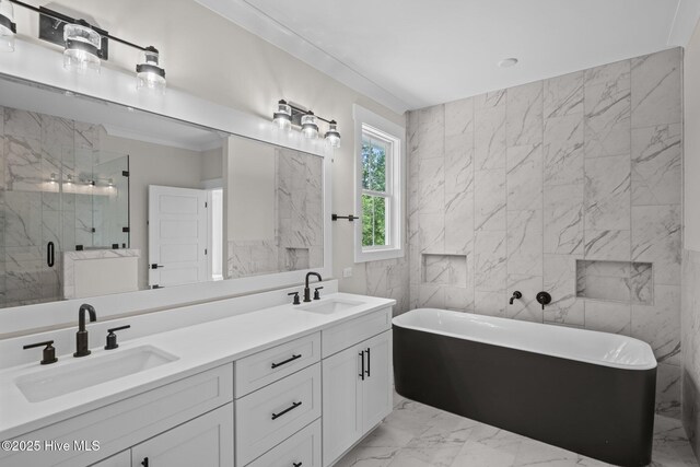 629 Vale Dr, Wilmington, NC 28411 - full bathroom featuring tile walls, marble finish flooring, a stall shower, a freestanding bath, and double vanity
