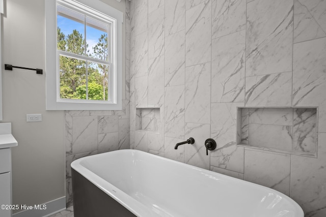 629 Vale Dr, Wilmington, NC 28411 - bathroom with a soaking tub and baseboards