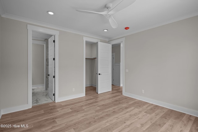 629 Vale Dr, Wilmington, NC 28411 - unfurnished bedroom featuring recessed lighting, baseboards, light wood-style flooring, a walk in closet, and ensuite bathroom