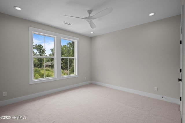 629 Vale Dr, Wilmington, NC 28411 - spare room featuring healthy amount of natural light, light colored carpet, a ceiling fan, and recessed lighting