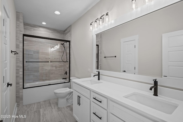 629 Vale Dr, Wilmington, NC 28411 - bathroom with recessed lighting, enclosed tub / shower combo, toilet, and double vanity