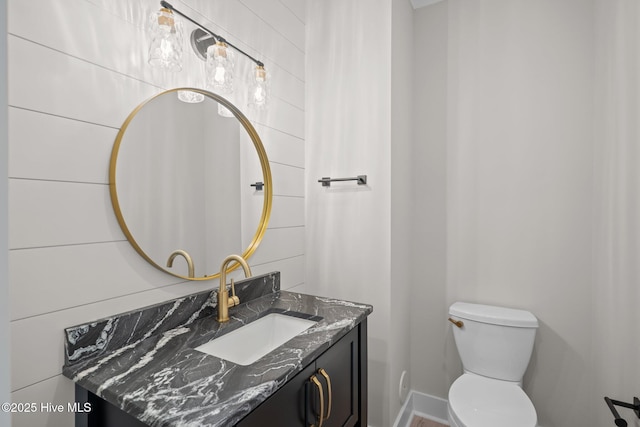 629 Vale Dr, Wilmington, NC 28411 - bathroom featuring toilet, vanity, and baseboards