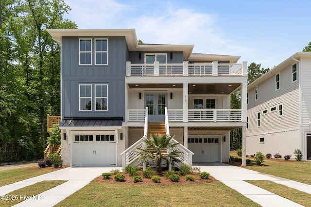 629 Vale Dr, Wilmington, NC 28411 - view of front of home with french doors, a balcony, board and batten siding, and stairs
