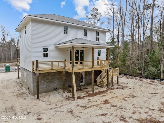 back of house featuring a wooden deck