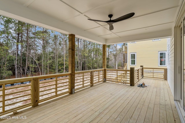 wooden terrace featuring a ceiling fan
