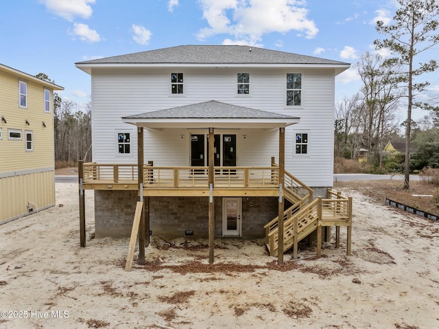 back of house featuring a deck