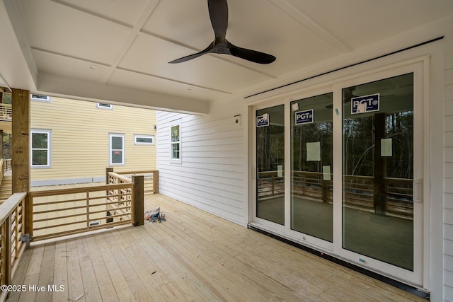 wooden deck with a ceiling fan