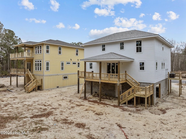 back of property with a wooden deck and central AC unit