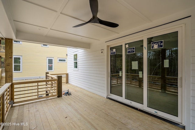 wooden terrace featuring ceiling fan