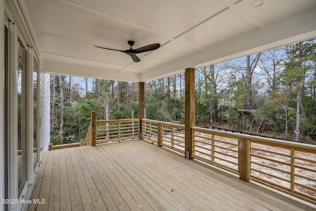 wooden deck featuring ceiling fan