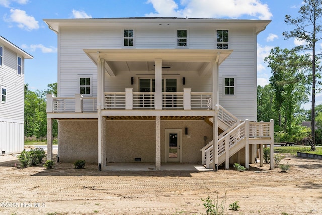 back of house with a patio and a wooden deck
