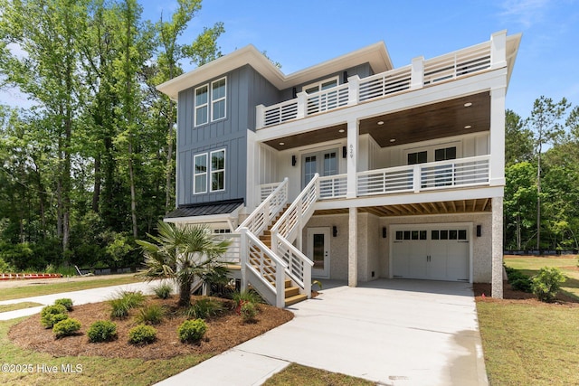 629 Vale Dr, Wilmington, NC 28411 - beach home with a balcony, french doors, board and batten siding, and concrete driveway