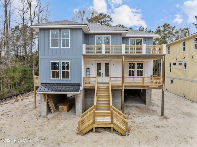 back of property featuring french doors and a balcony