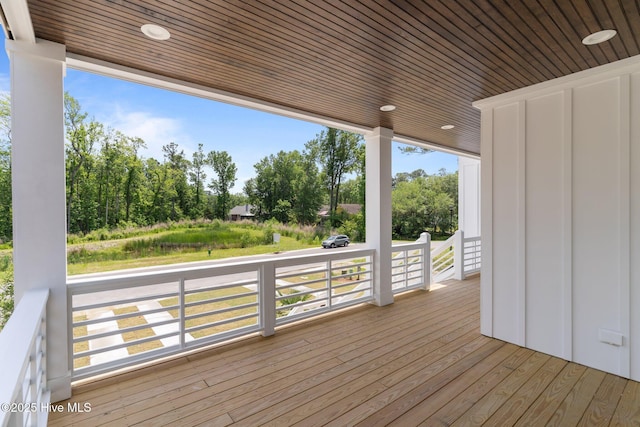 629 Vale Dr, Wilmington, NC 28411 - wooden deck featuring view of wooded area