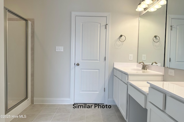 bathroom with vanity, tile patterned floors, and walk in shower