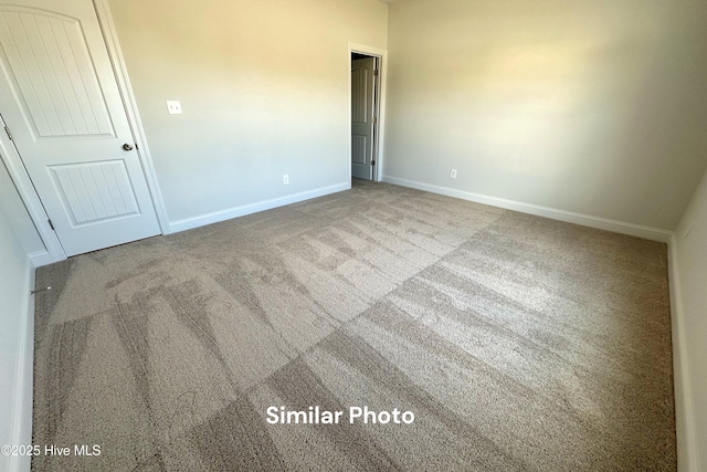 unfurnished room with carpet flooring