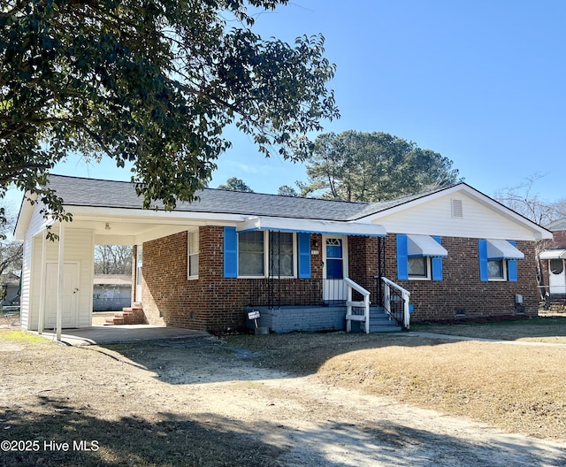 view of front of home with a carport