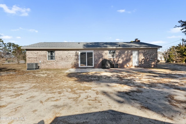 rear view of house featuring central AC and a patio area