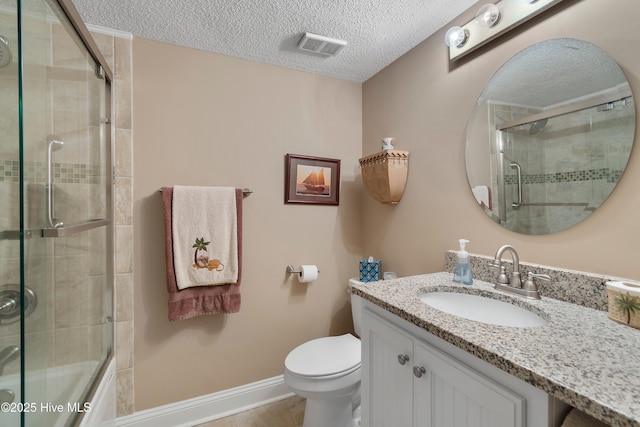 full bathroom featuring toilet, a textured ceiling, vanity, and shower / bath combination with glass door