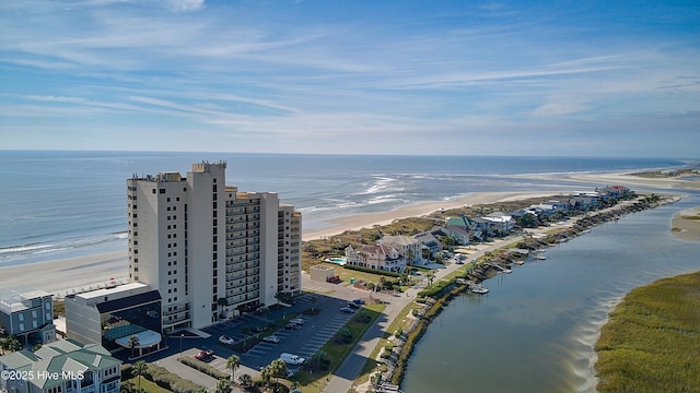 aerial view featuring a view of the beach and a water view