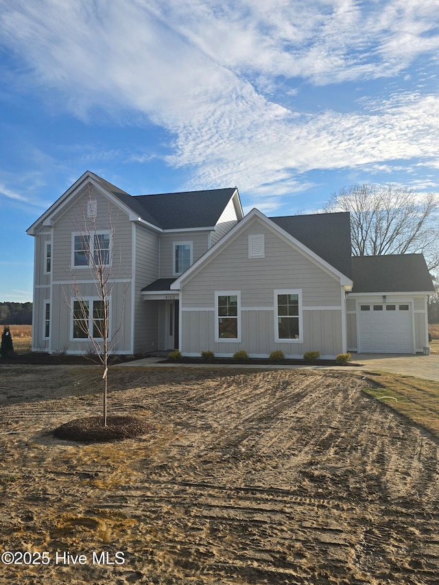 traditional home featuring a garage and board and batten siding