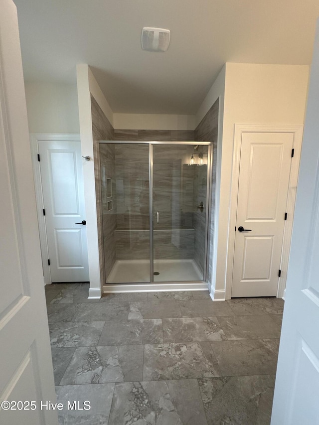 4158 Dixon Rd, Grimesland, NC 27837 - bathroom with baseboards, marble finish floor, a stall shower, and vanity